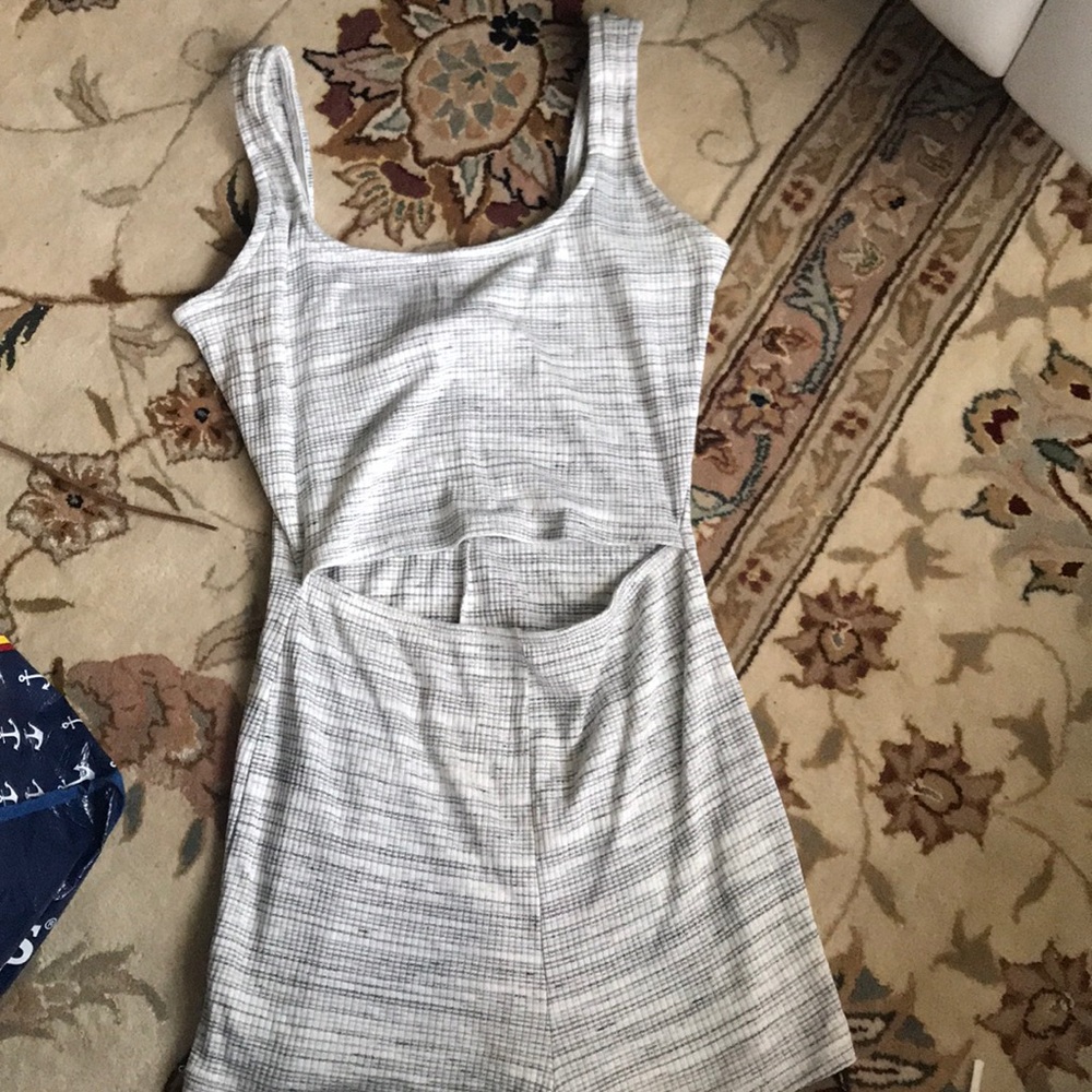 Very cute short romper with stomach slit